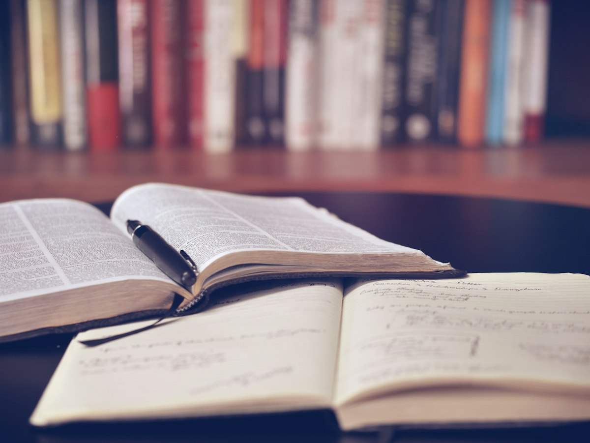 Open books on a study desk